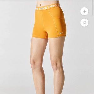 Orange Nike pro shorts